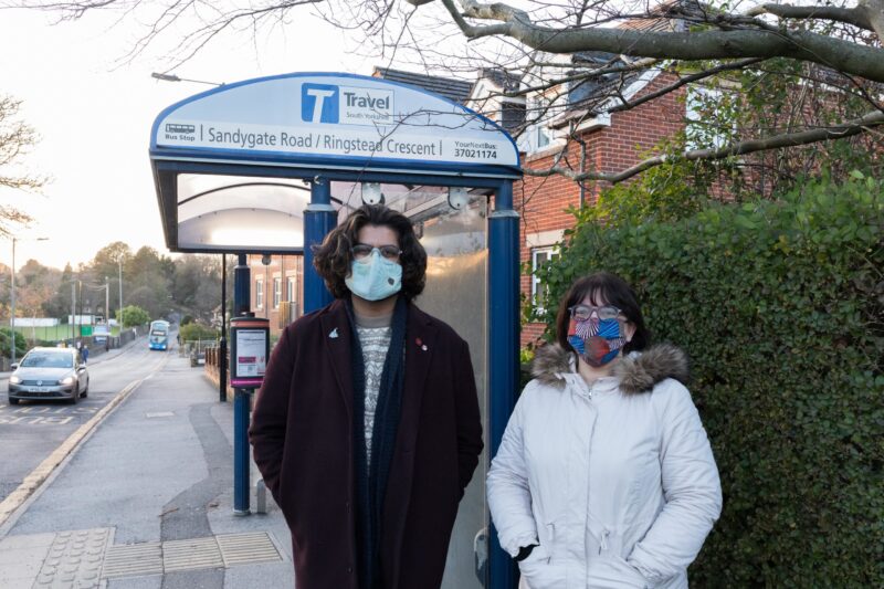 Crookes & Crosspool Councillors at a bus stop in Crosspool. (Left, Minesh Parekh; Right, Ruth Milsom)